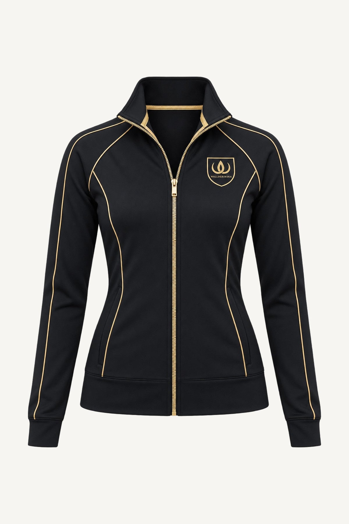 Goldline Träningsjacka van voren, vrijstaand. Zwart met gouden schild op de borst, gouden bies langs de naden en goudkleurige rits helemaal tot boven.